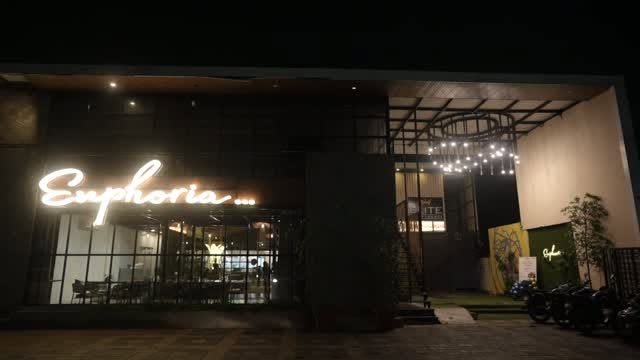 Euphoria's neon sign glowing at night